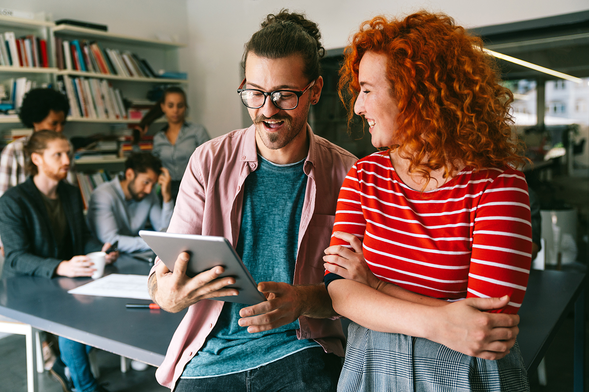 Developing programming and coding technologies. Programmer working in a software develop company Team members collaborating with a tablet, representing streamlined automation and efficient change management.