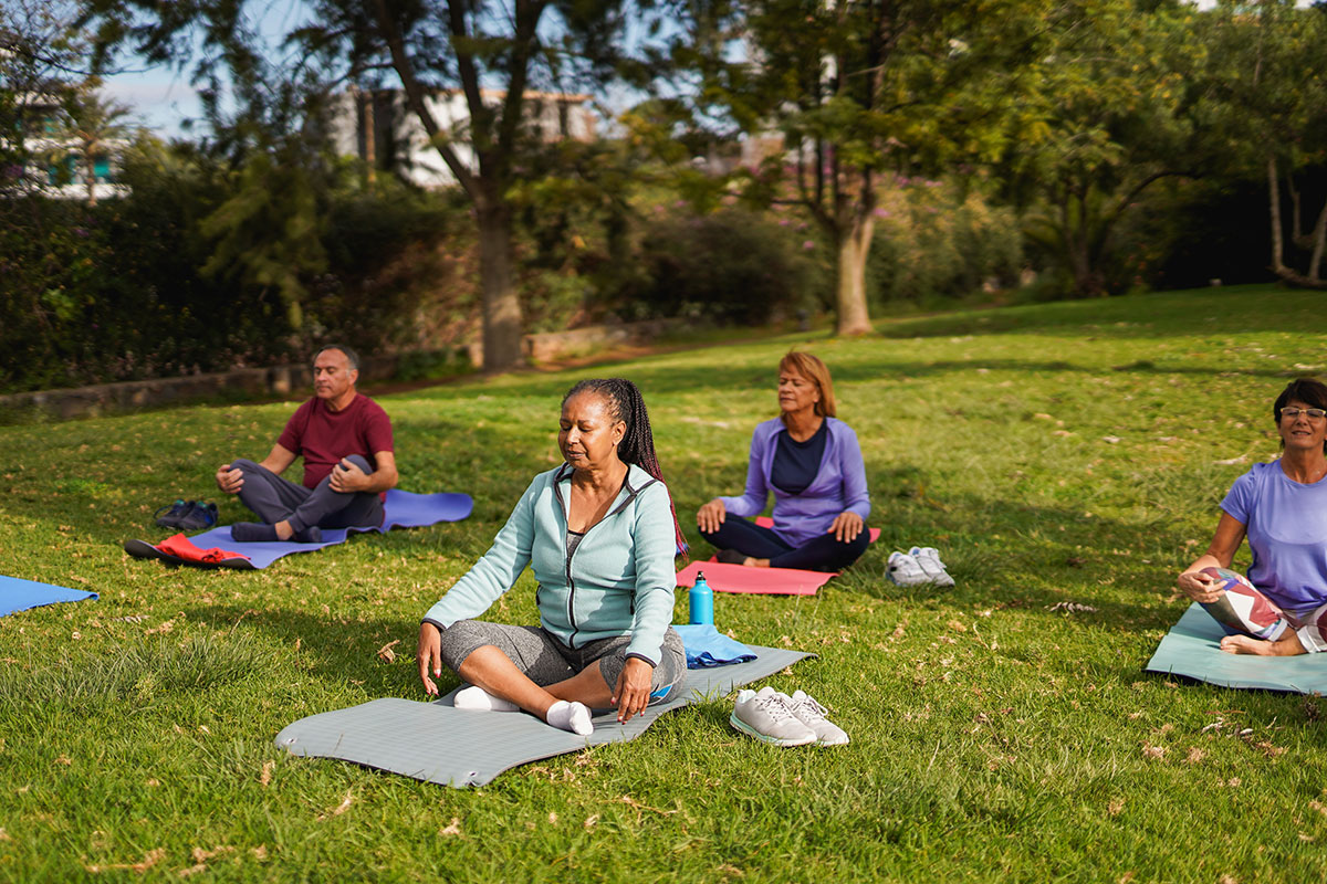 AdobeStock_1326894497 Citizens gathered in a park for a community activity, representing streamlined municipal service requests and citizen engagement through C2 ITSM.