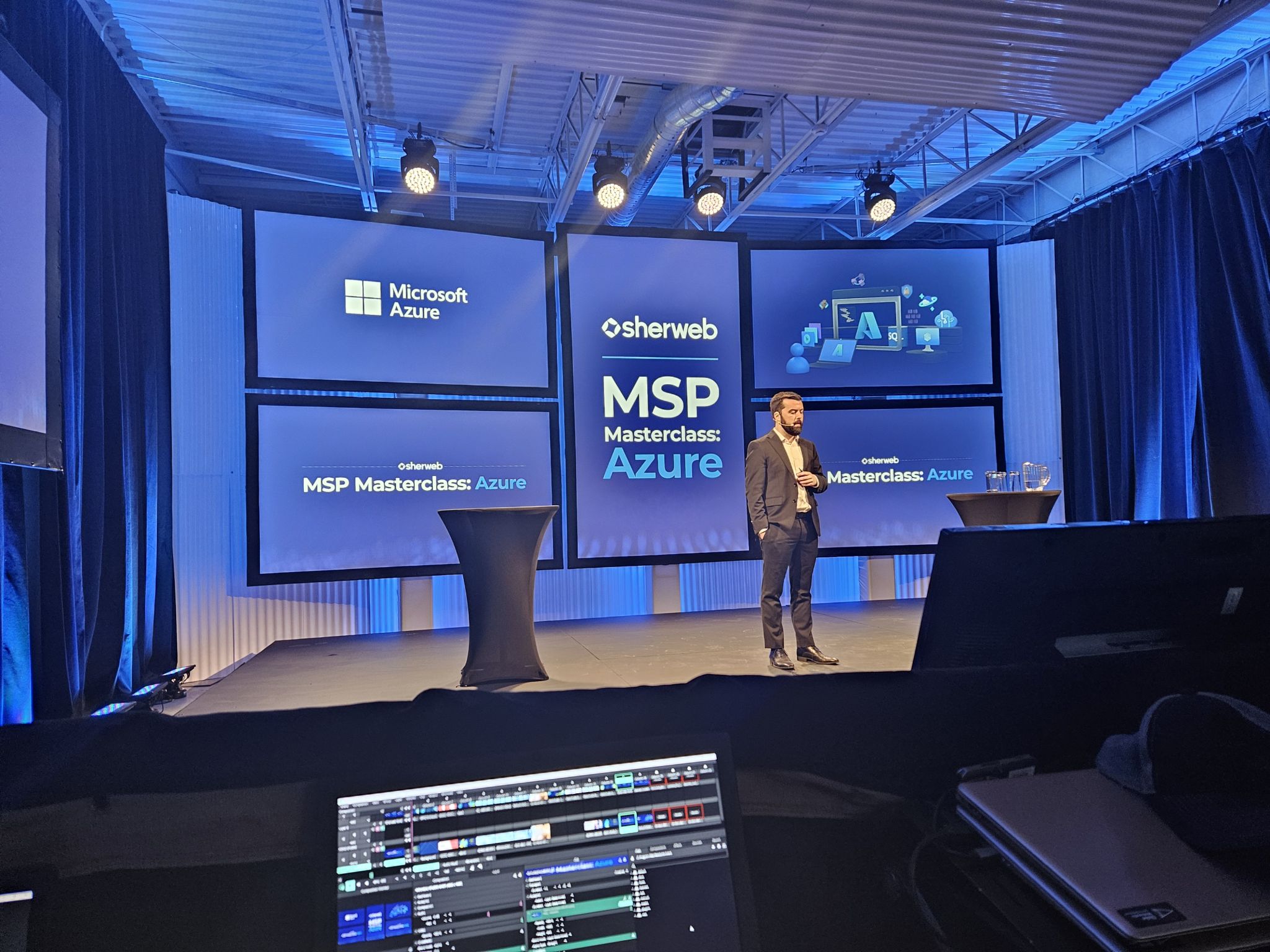 1743531131517 Sherweb team presenting on stage at an MSP event about cloud innovation and C2 ITSM integration.